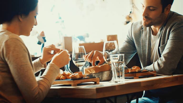 couple-in-early-thirties-dining-in-restaurant